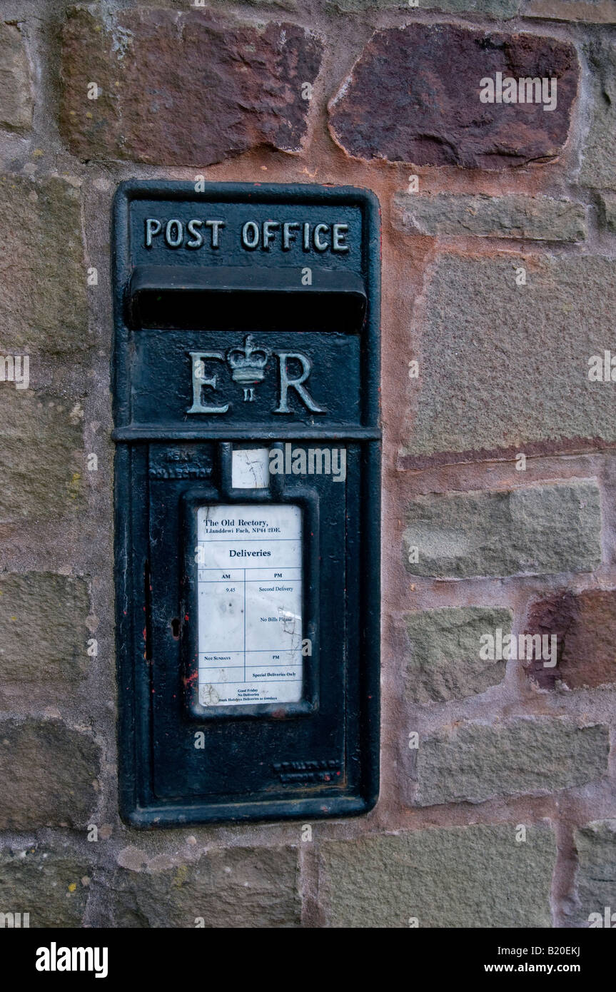 Black Wall Mounted Letter Box in Monmouthshire South Wales Stock Photo