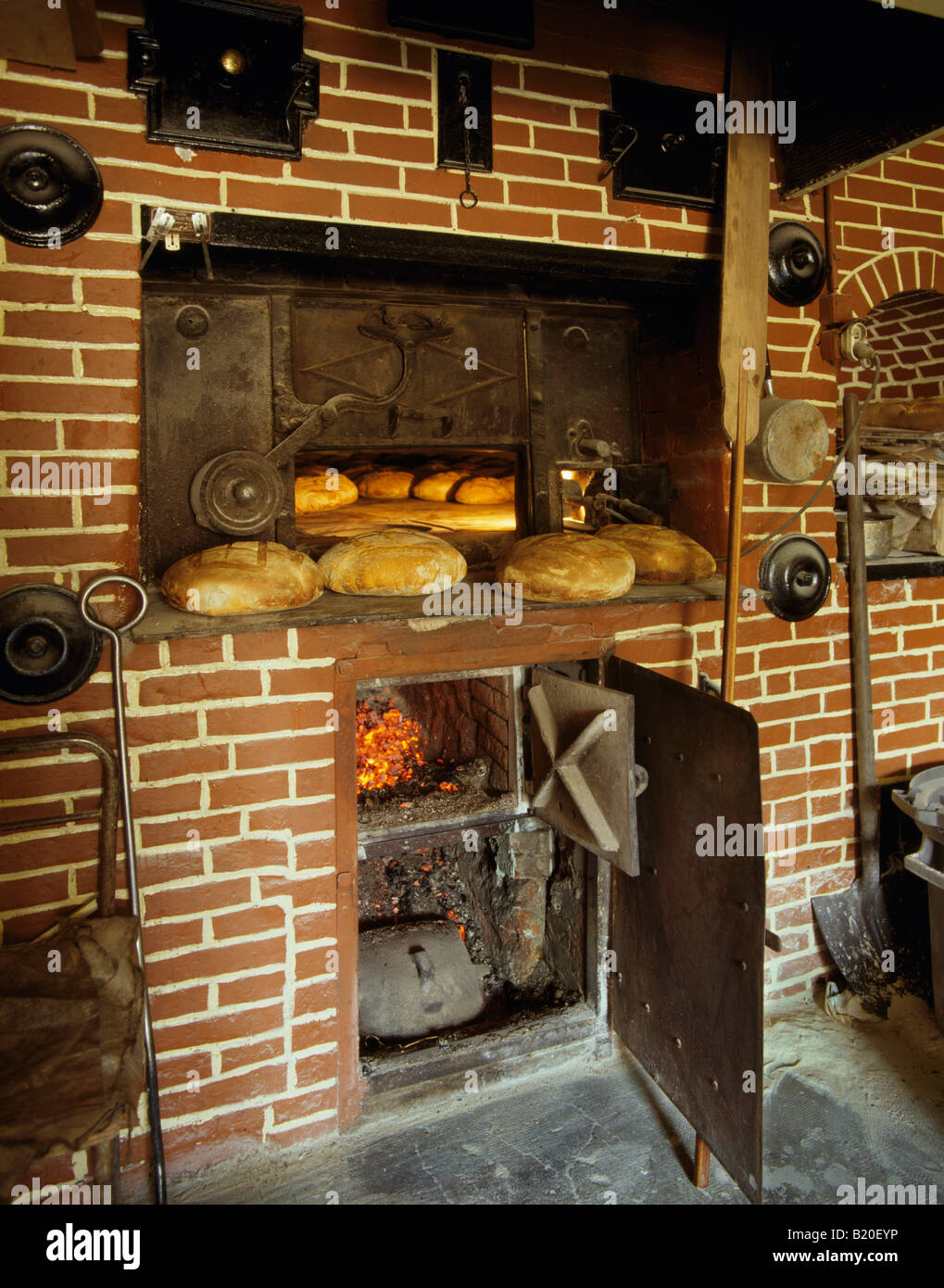 Baking bread in a wood fired oven La Roquette near ...