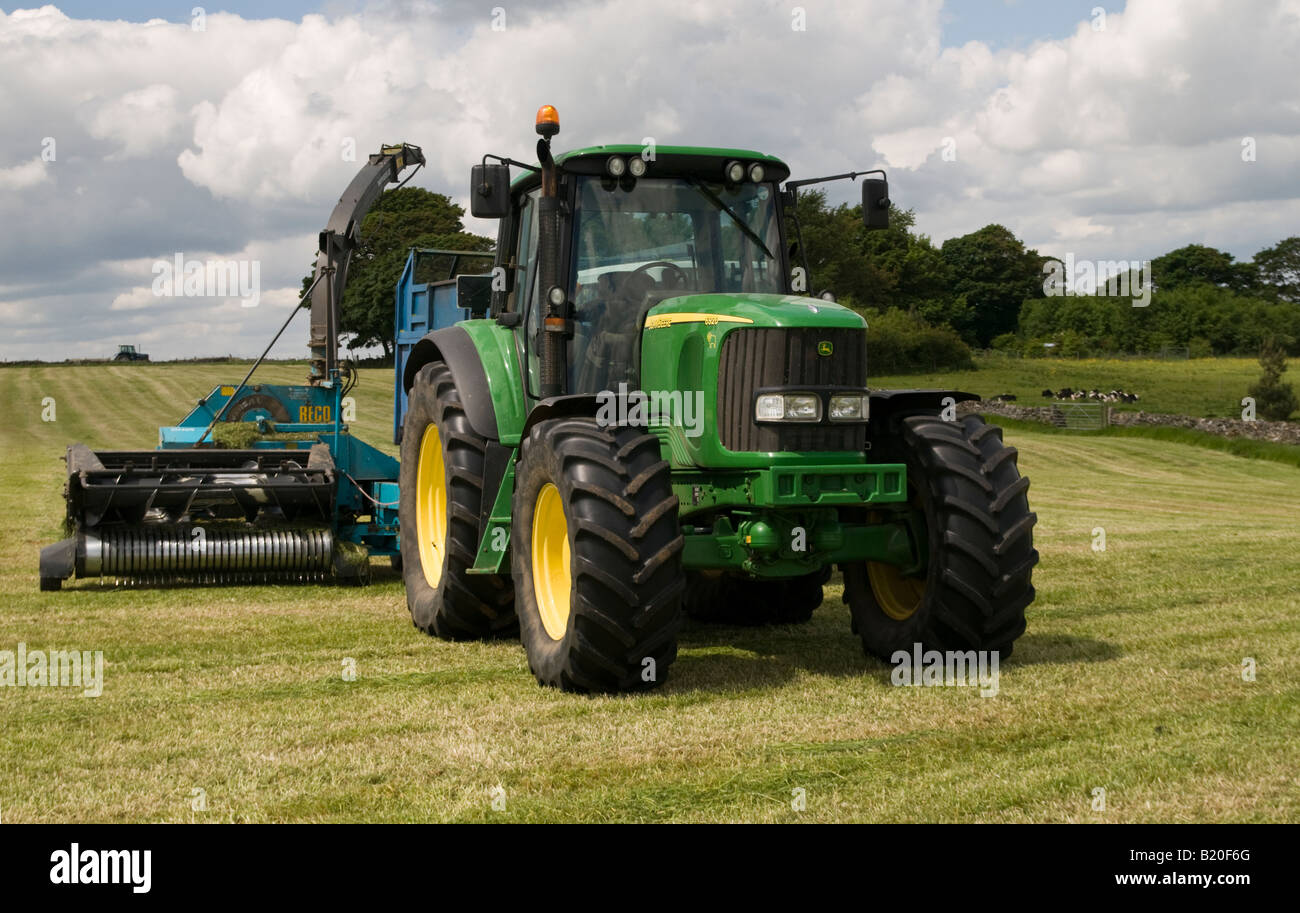 Farm tractor with grass cutter Derbyshire Peak District National Park