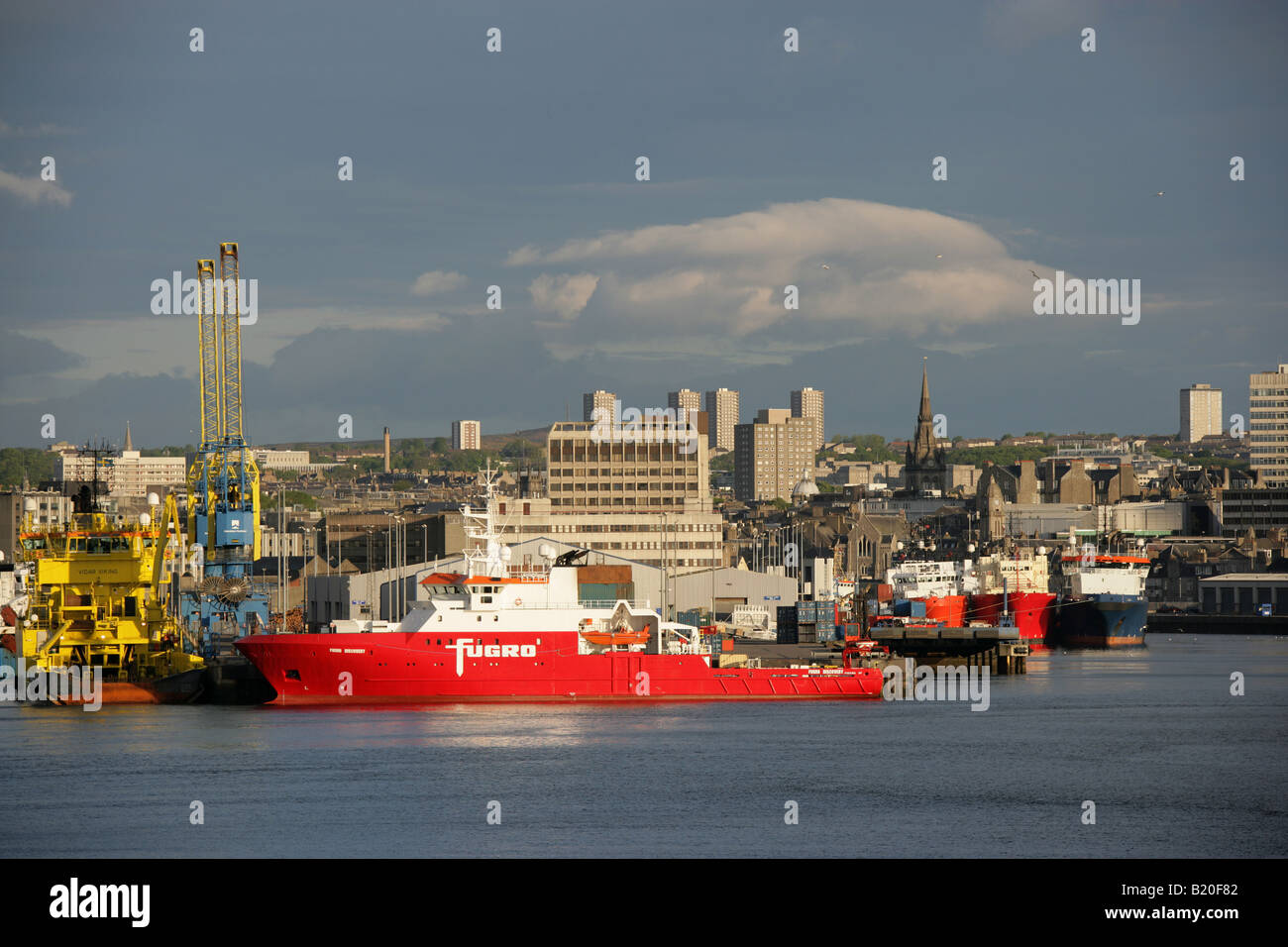 City of Aberdeen, Scotland. Morning view of Aberdeen Harbour with fishing boats and oil support ships berthed in the background. Stock Photo