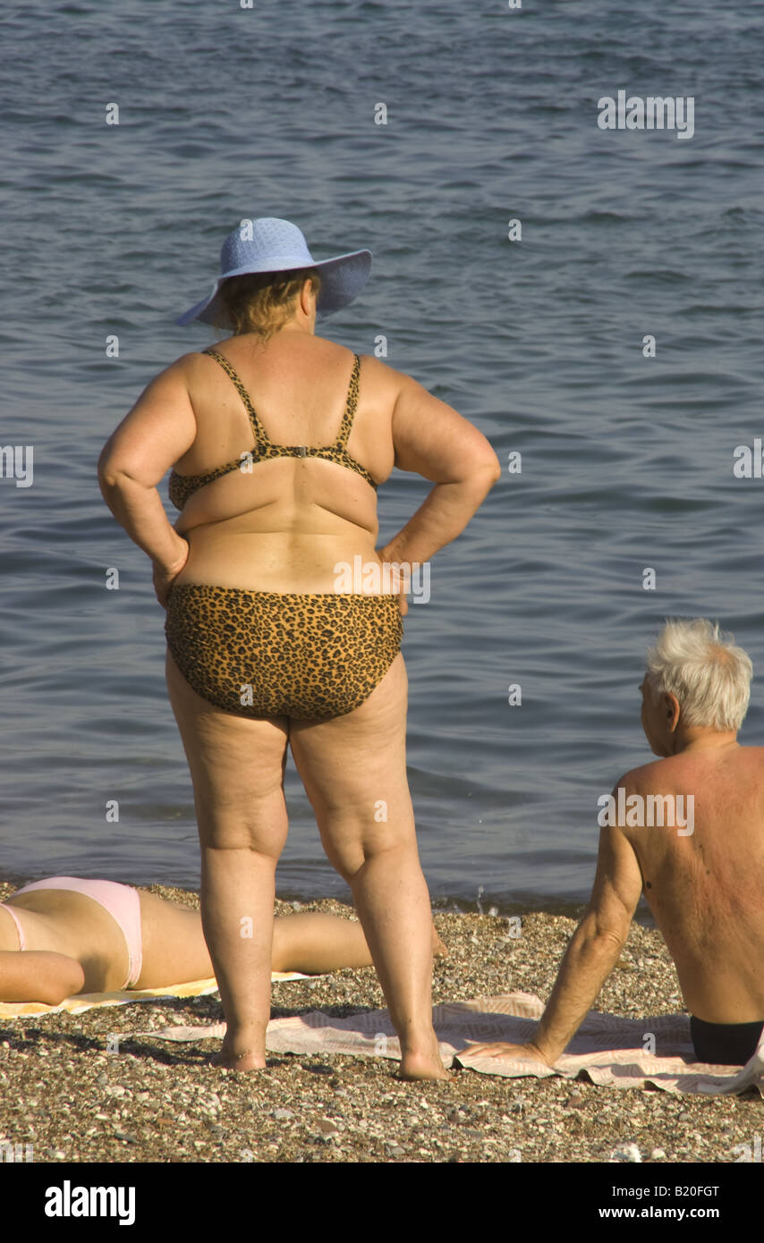 Budva beach sun bathers on Adriatic coast of Montenegro Stock Photo