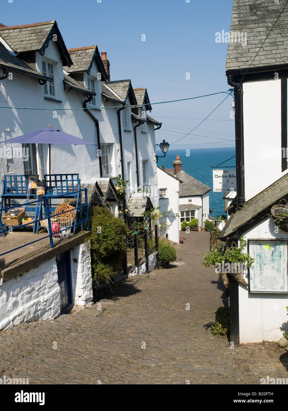 The cobbled street leading down to the harbour area in the historic fishing village of Clovelly, North Devon England UK Stock Photo