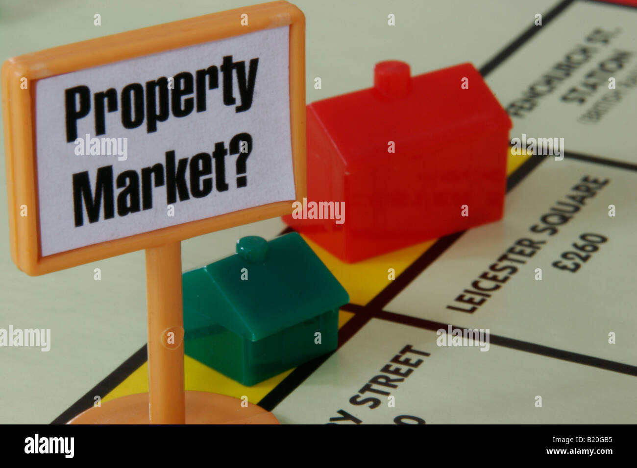 Monopoly houses with 'Propery Market?' sign on the playing board Stock