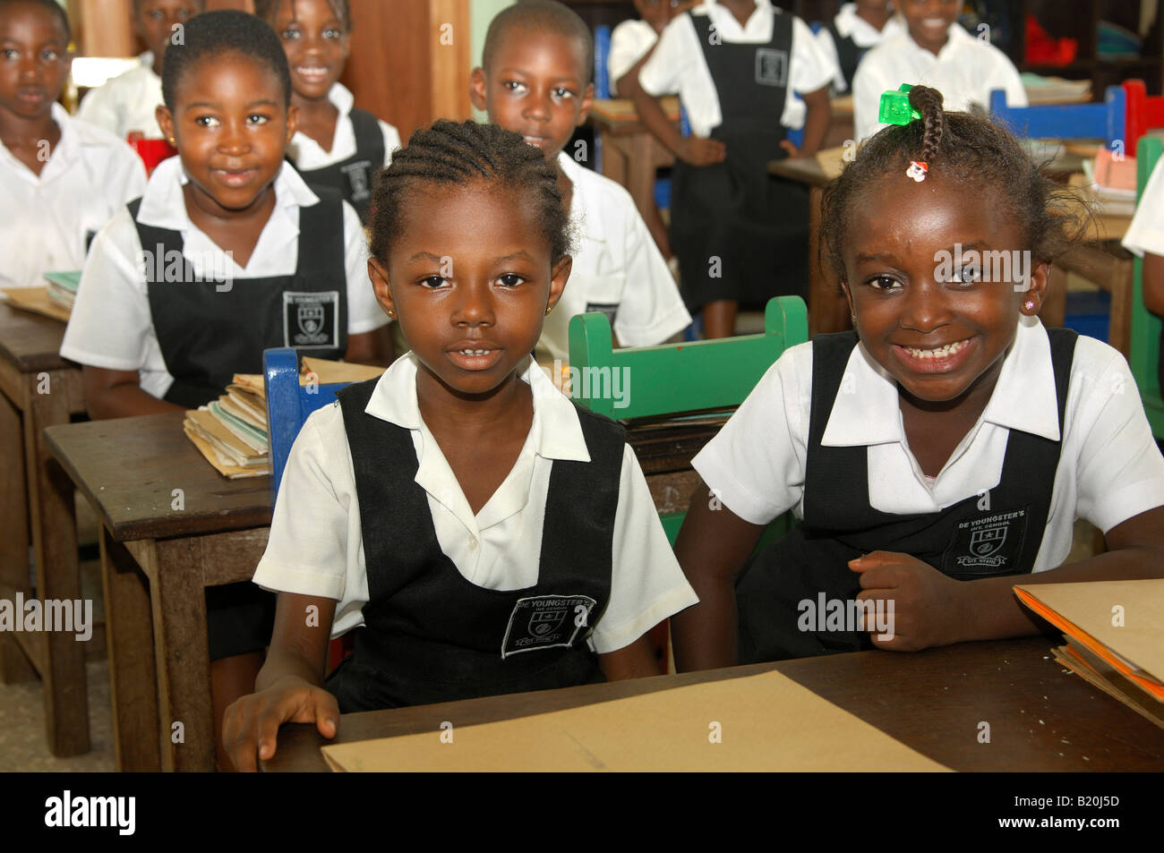 Smiling students of a primary class of the De Youngsters International School Accra Ghana Stock Photo