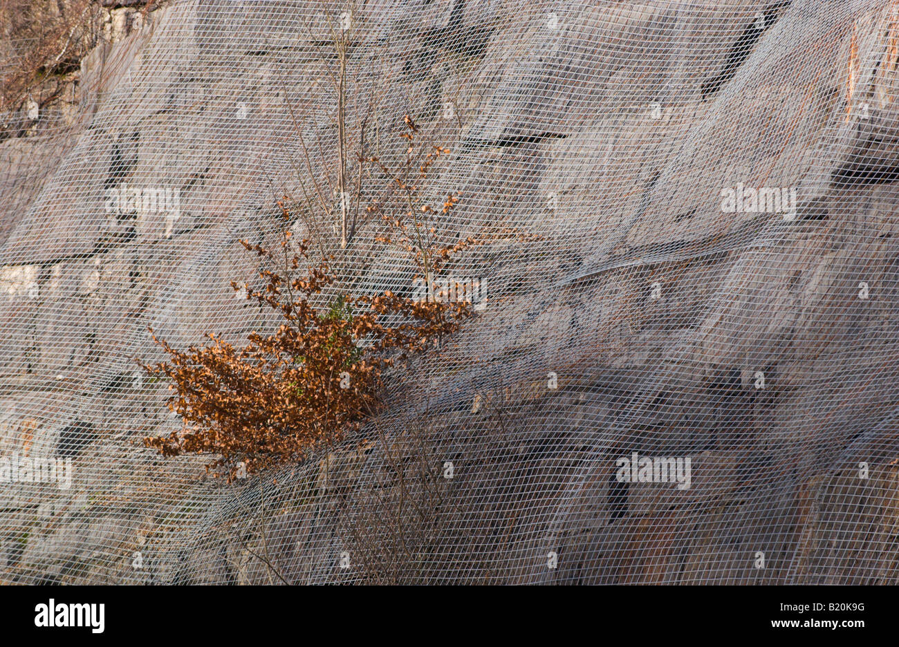 Mesh In Rocks Steel mesh placed over rock face to prevent loose rock falling onto ...