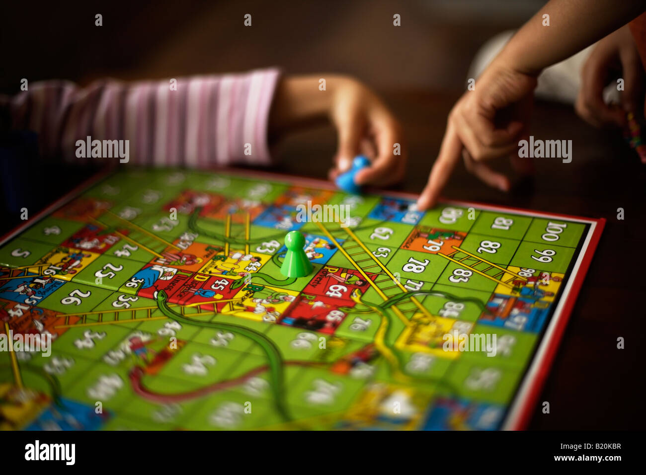 Children Playing Snakes And Ladders
