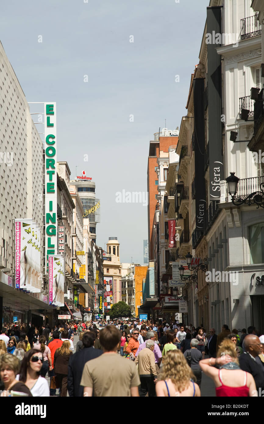 SPAIN Madrid Crowd of shoppers passing El Corte Ingles department store on Calle Preciados pedestrian shopping district Stock Photo