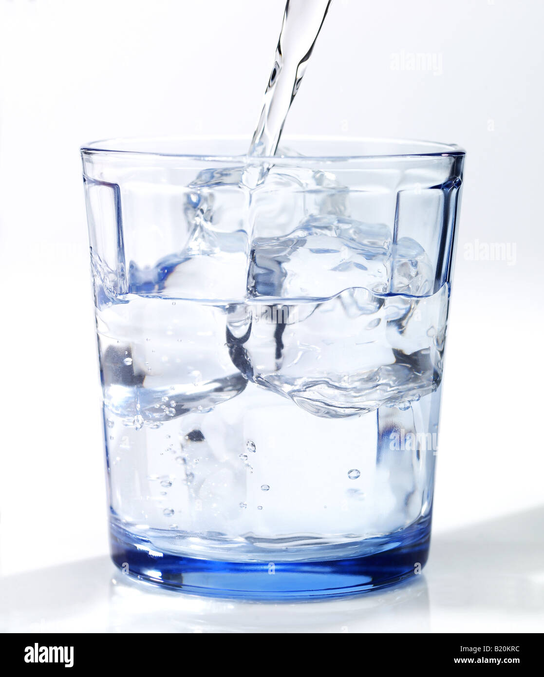 Glass of water being poured Stock Photo