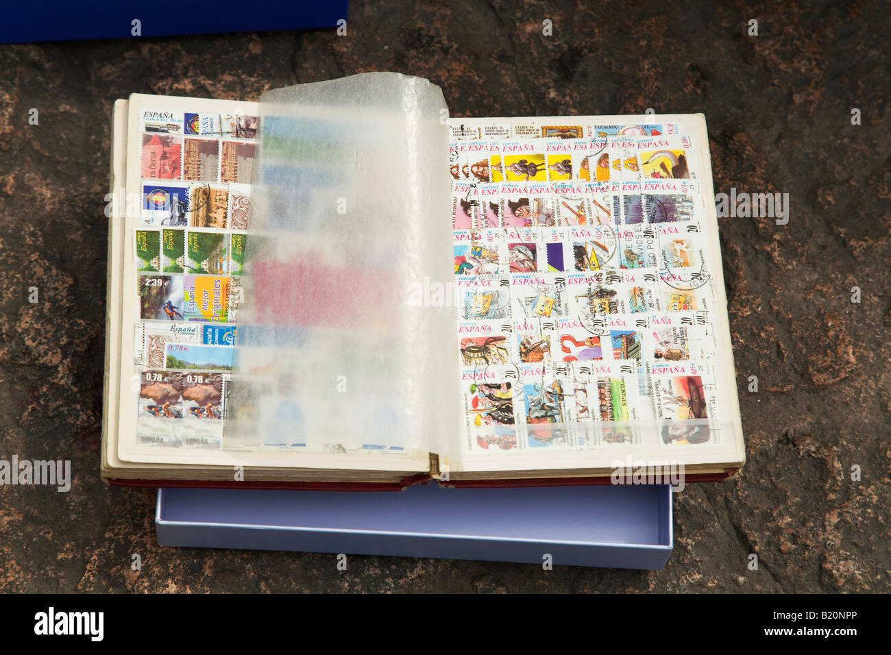 SPAIN Madrid Stamp collectors trade and sell collections in Plaza Mayor on Sunday morning Notebook with vellum leaf of stamps Stock Photo