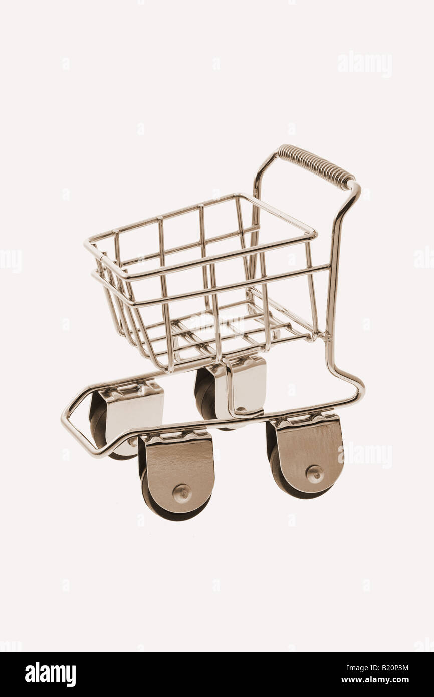 Mini toy shopping cart isolated on off white background Stock Photo Alamy