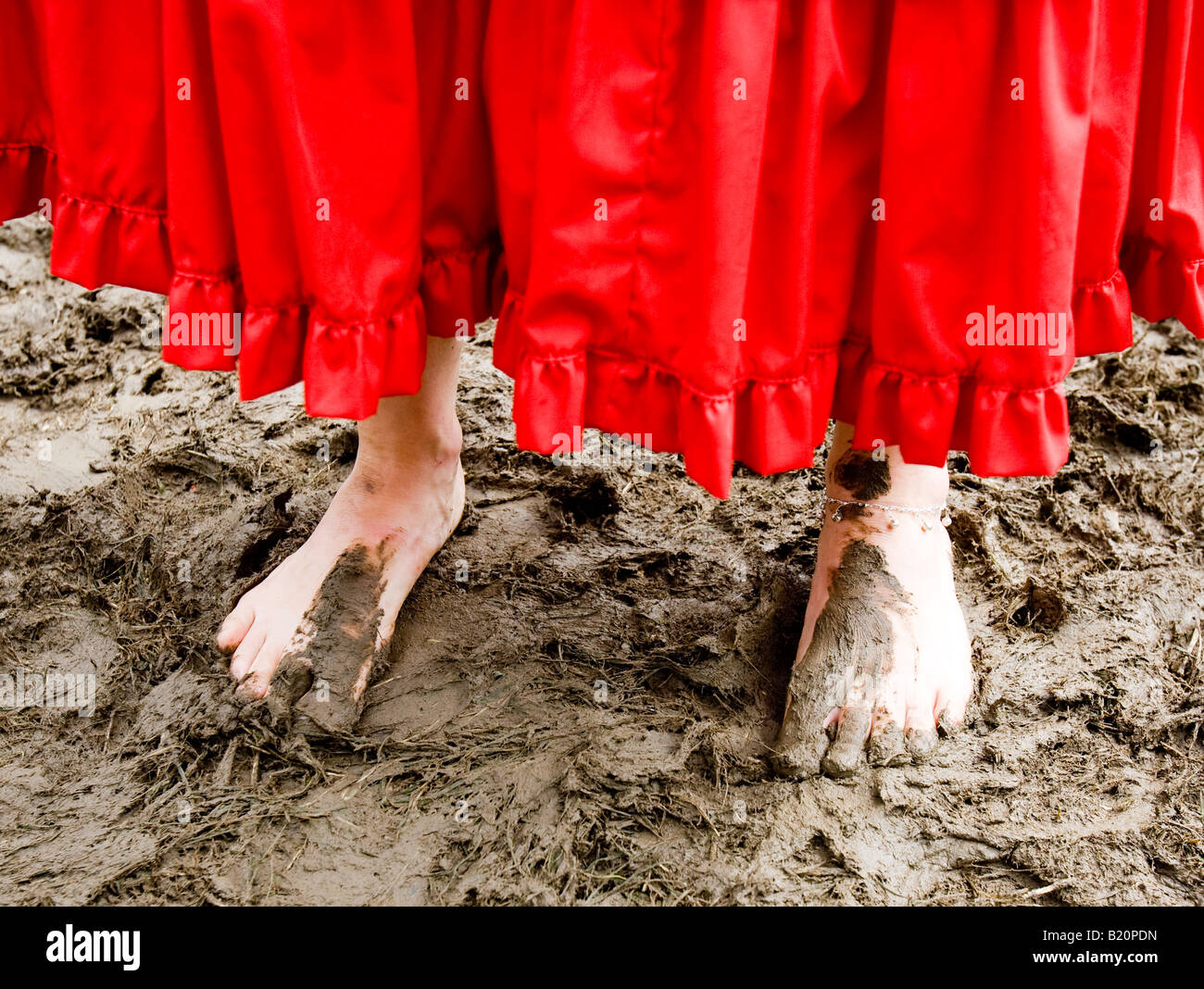 Woman Walking Barefoot In Mud