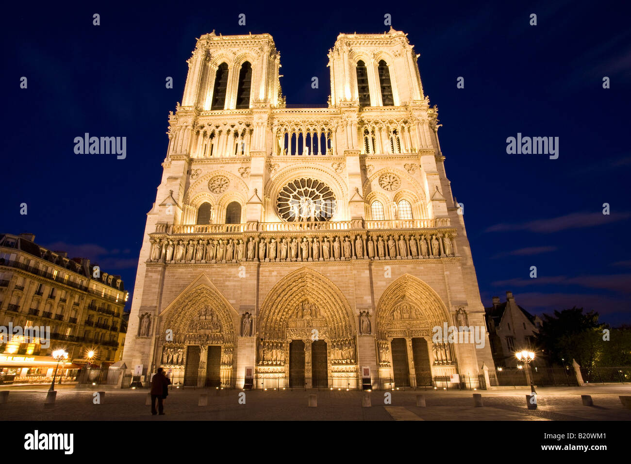 Notre Dame Cathedral floodlit illuminated illuminations in evening night light Paris France Europe EU Stock Photo