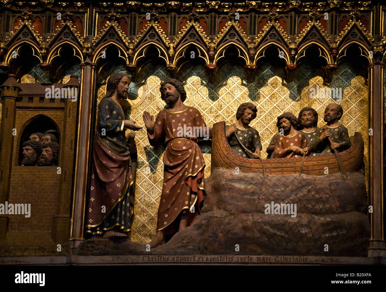 14th Century Painted Wood Carvings of the life of Jesus on Choir Screen Notre Dame Cathedral interior Paris France Stock Photo