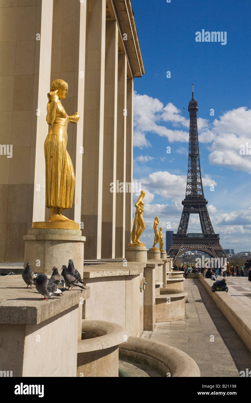 Eiffel Tower and Gold Statues on the Esplanade of the Palais Chaillot in spring sunshine daytime Paris France Europe EU Stock Photo