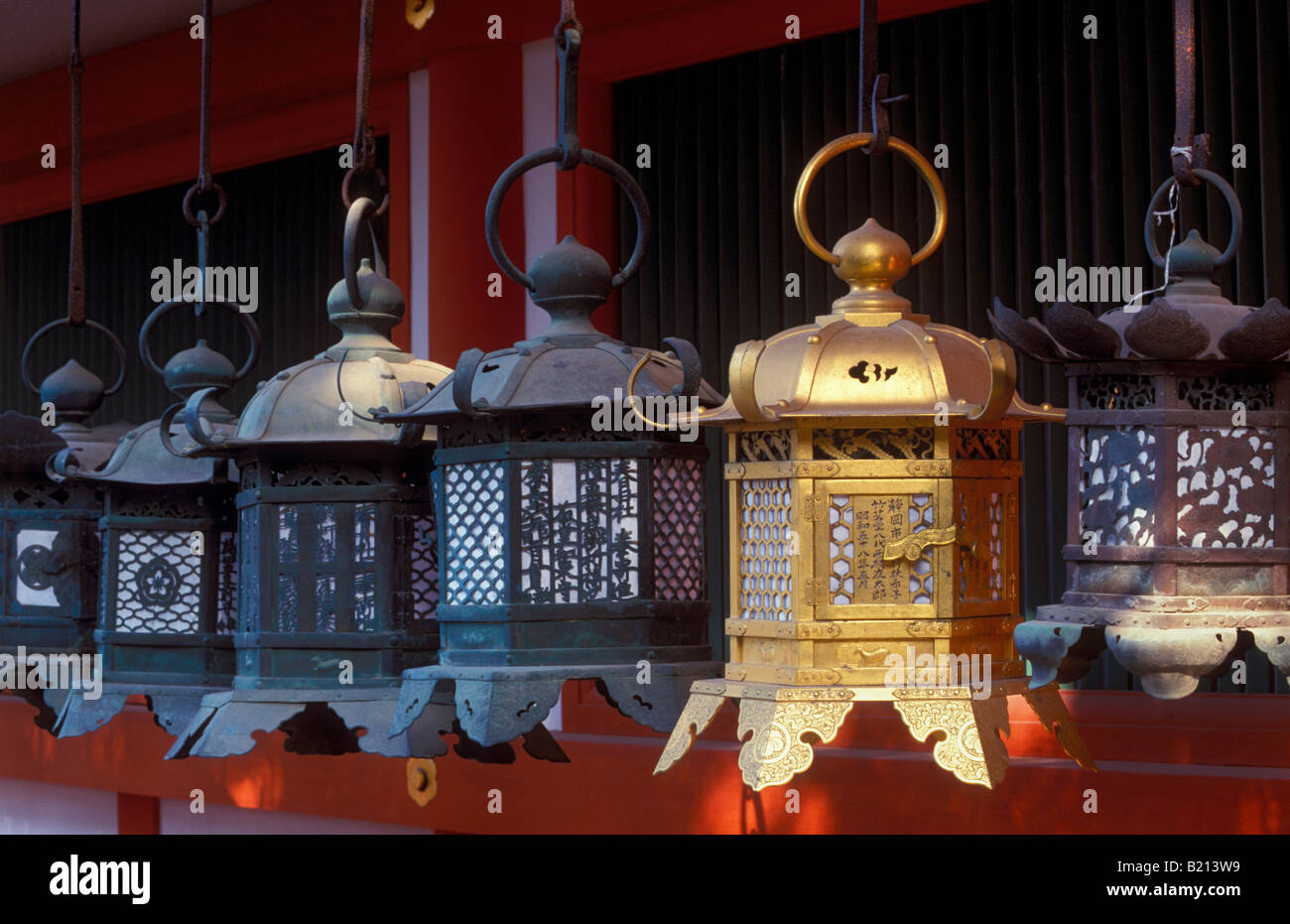 Hanging steel lanterns decorate the exterior of Kasuga Taisha shrine in Nara Stock Photo
