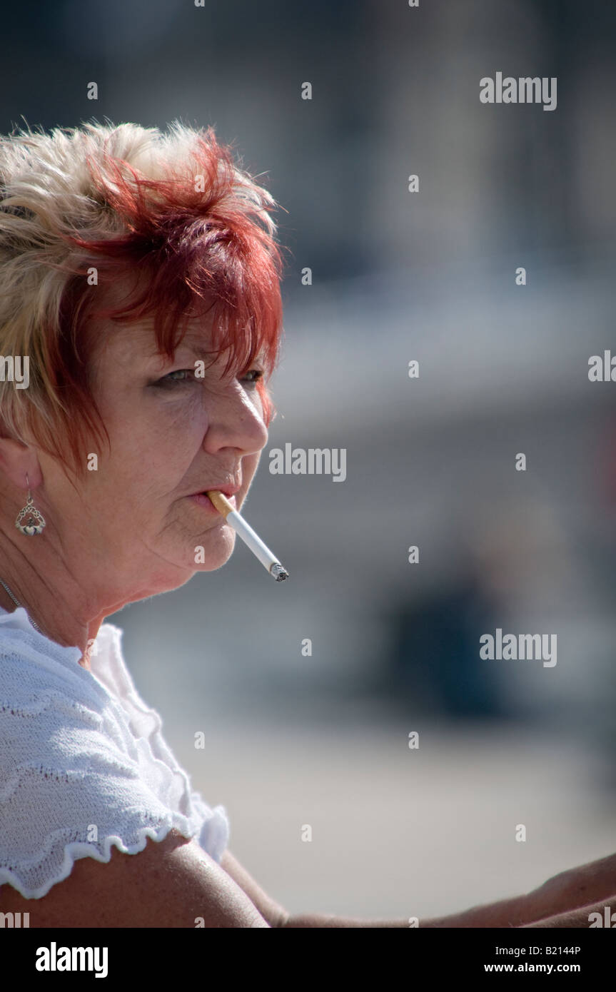 Middle aged woman smoking hi-res stock photography and images