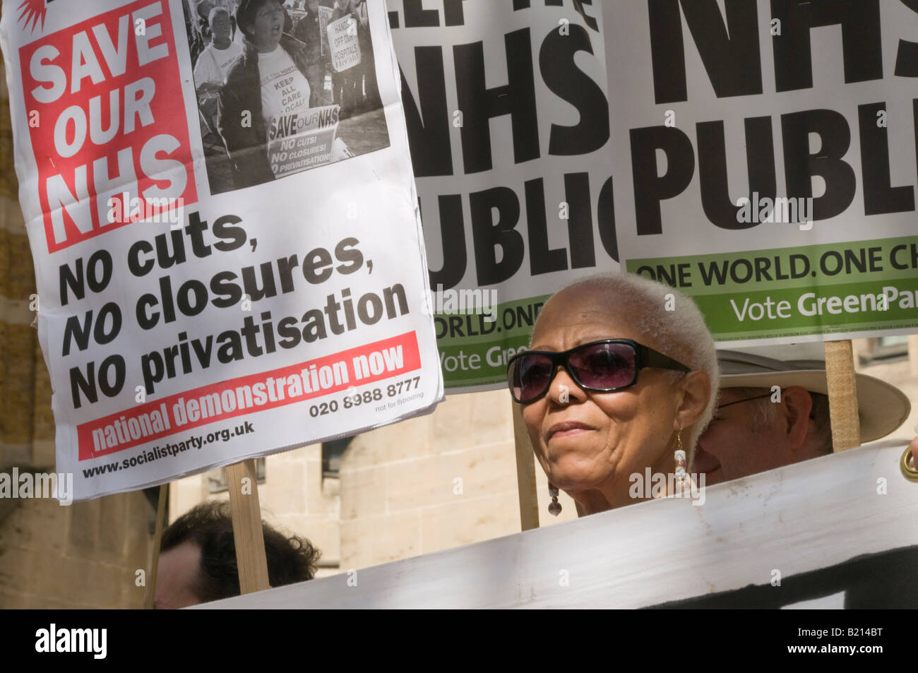 Black Woman And Placards At London Keep Our Nhs Public Demo