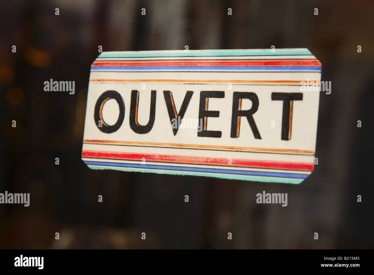 Sign at the entrance of a restaurant saying in French - Ouvert - meaning in  English - Open Stock Photo - Alamy