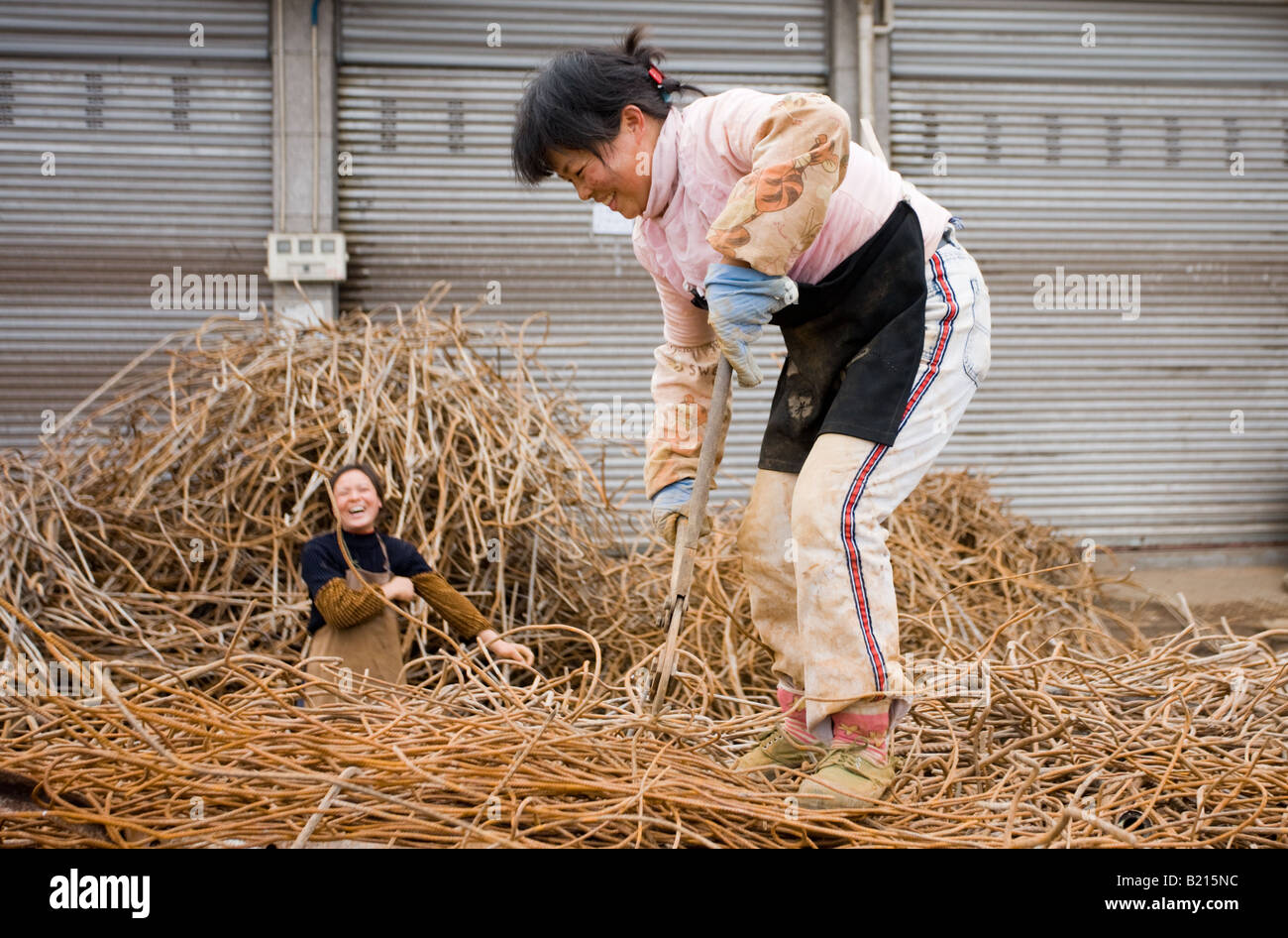 Women working at metal recycling steel in Dazu County Chongqing China Stock Photo