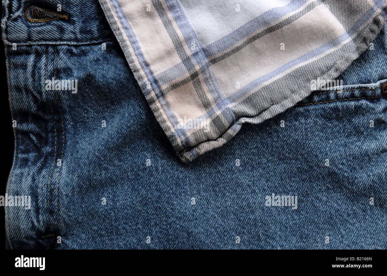 beige flannel shirt over a pair of jeans Stock Photo