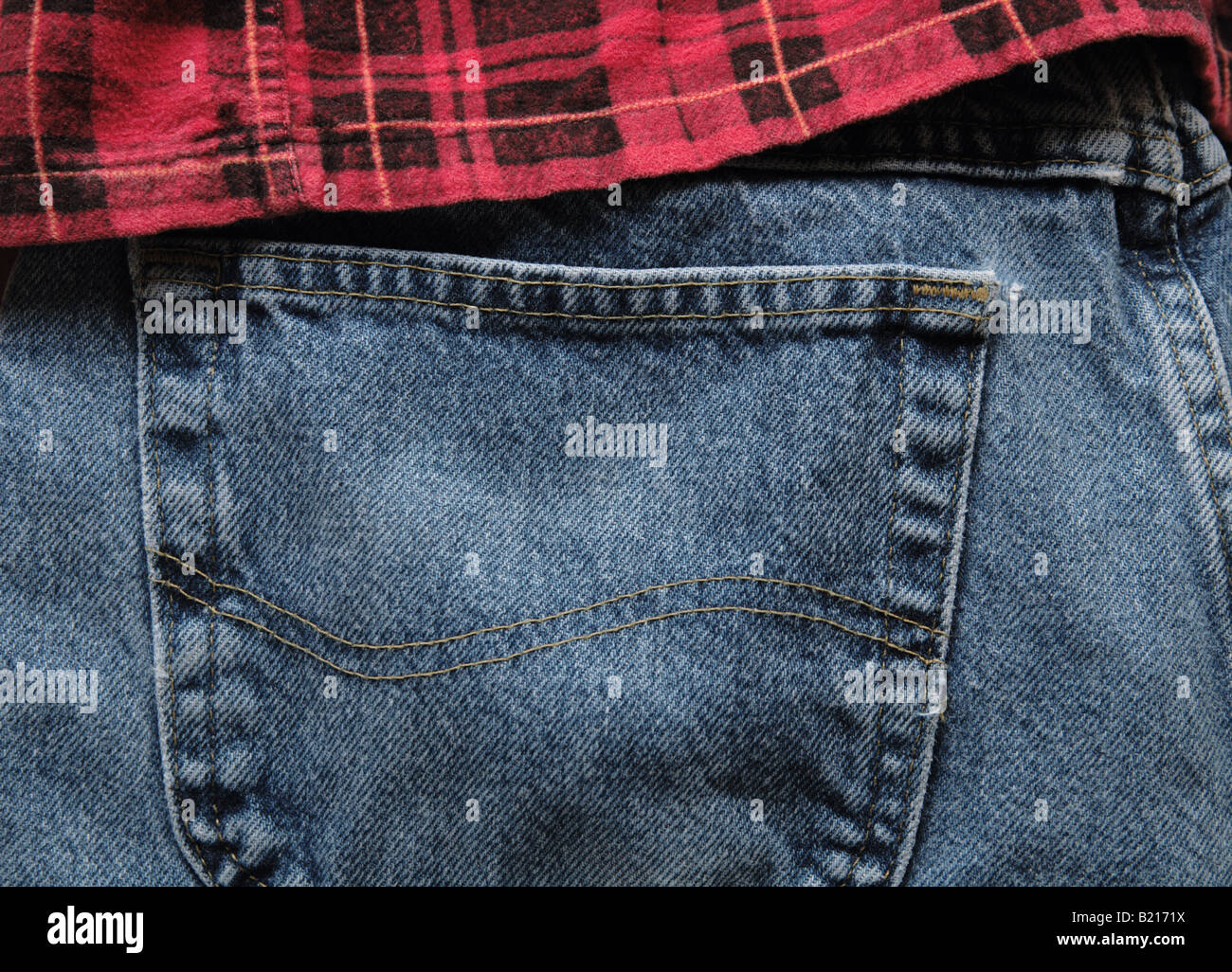 red flannel shirt over a pair of jeans Stock Photo Alamy