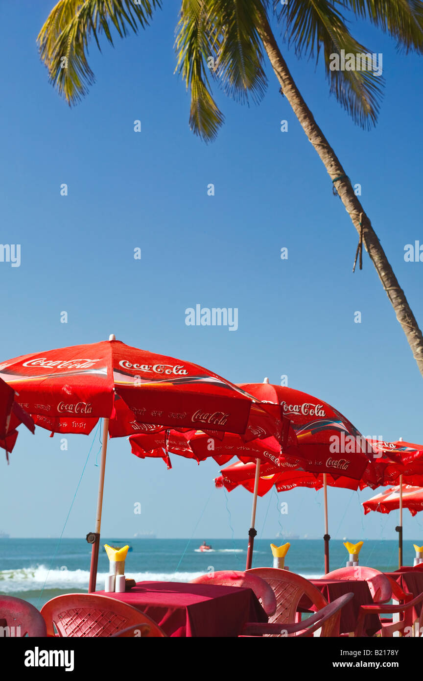 Restaurant tables and parasols overlooking the beach at Baga in Goa, India. Stock Photo