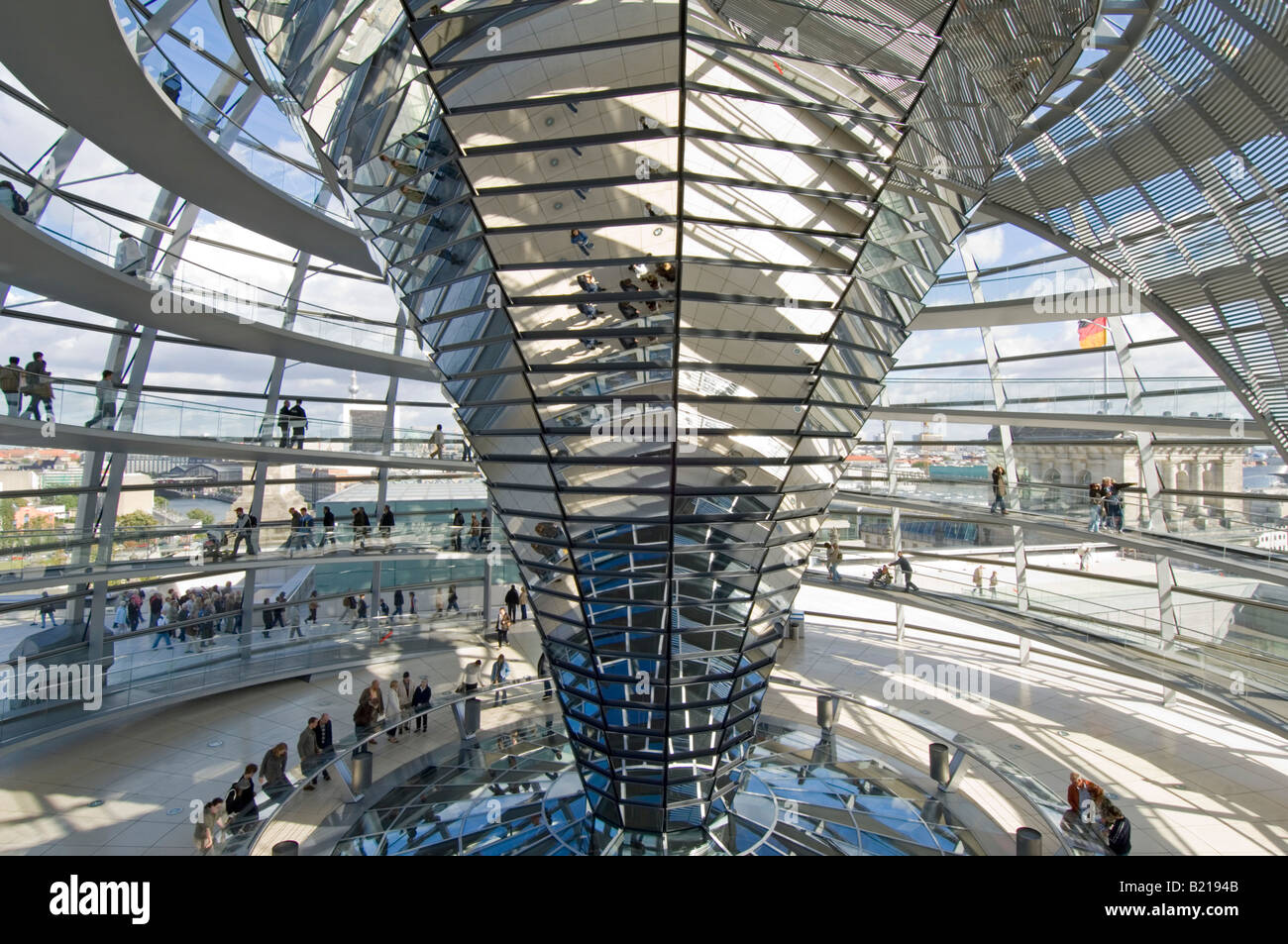 A wide angle view of tourists inside the dome on top of the Reichstag - the german parliment building. Stock Photo