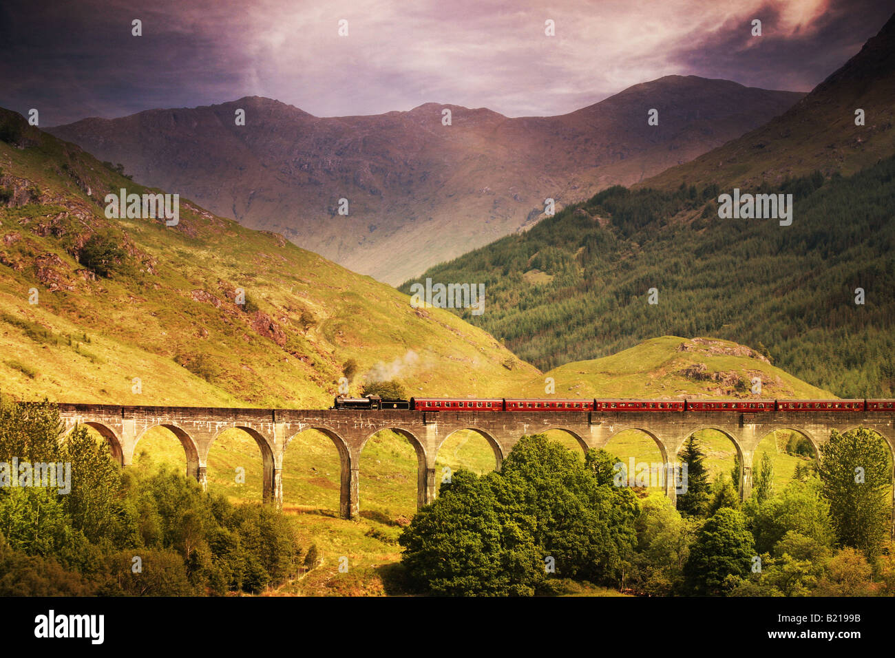 Jacobite steam train crossing Glenfinnan viaduct Stock Photo - Alamy