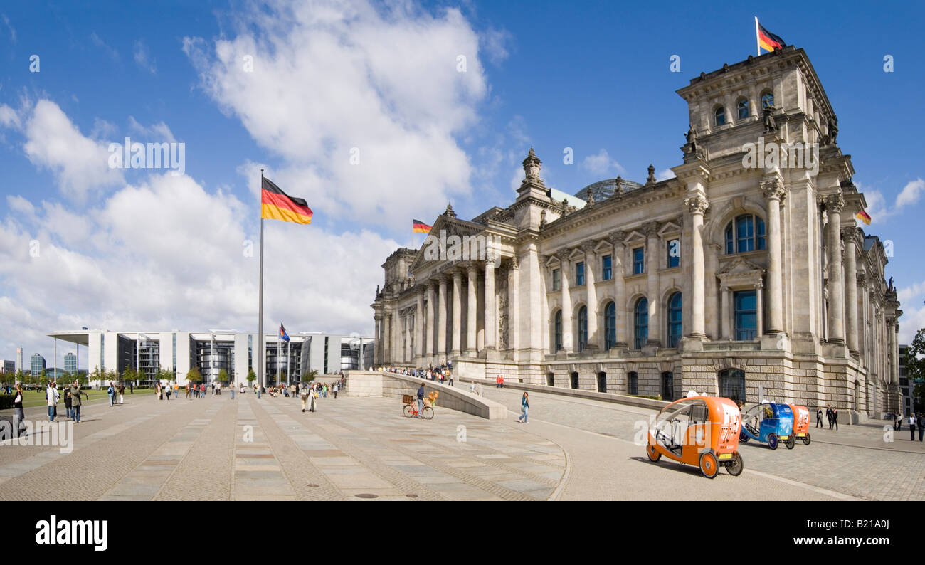 A 2 picture stitch panoramic view of the Reichstag (German Parliment Building) and tourists on a sunny day. Stock Photo
