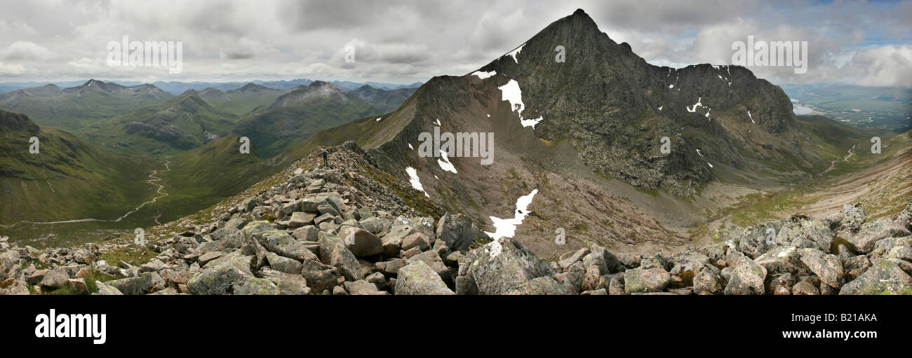 Hiker descending onto the CMD Arete from Carn More Dearg enroute to Ben Nevis Stock Photo