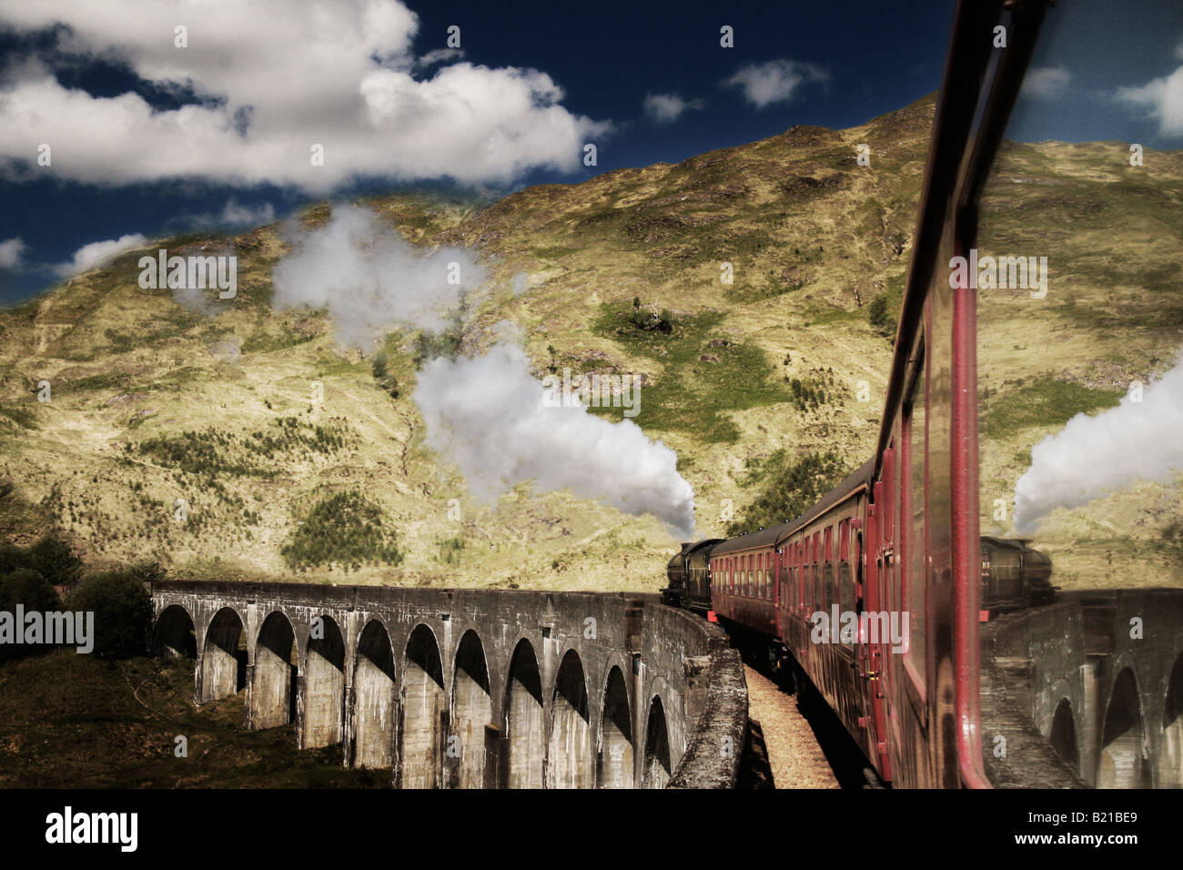 Jacobite steam train crossing Glenfinnan viaduct Stock Photo