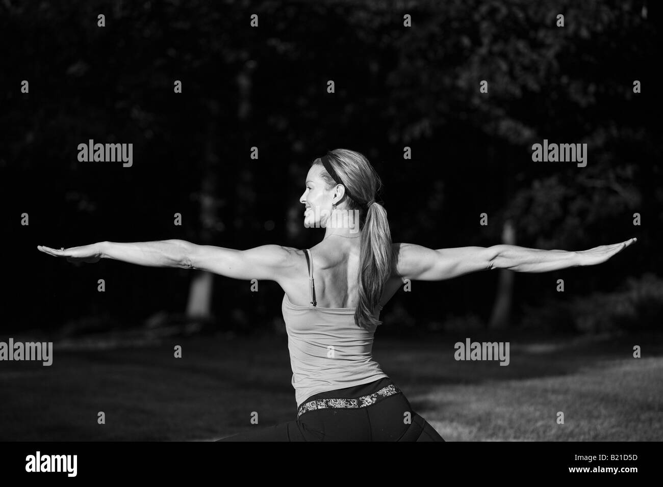 An athletic woman doing yoga Stock Photo