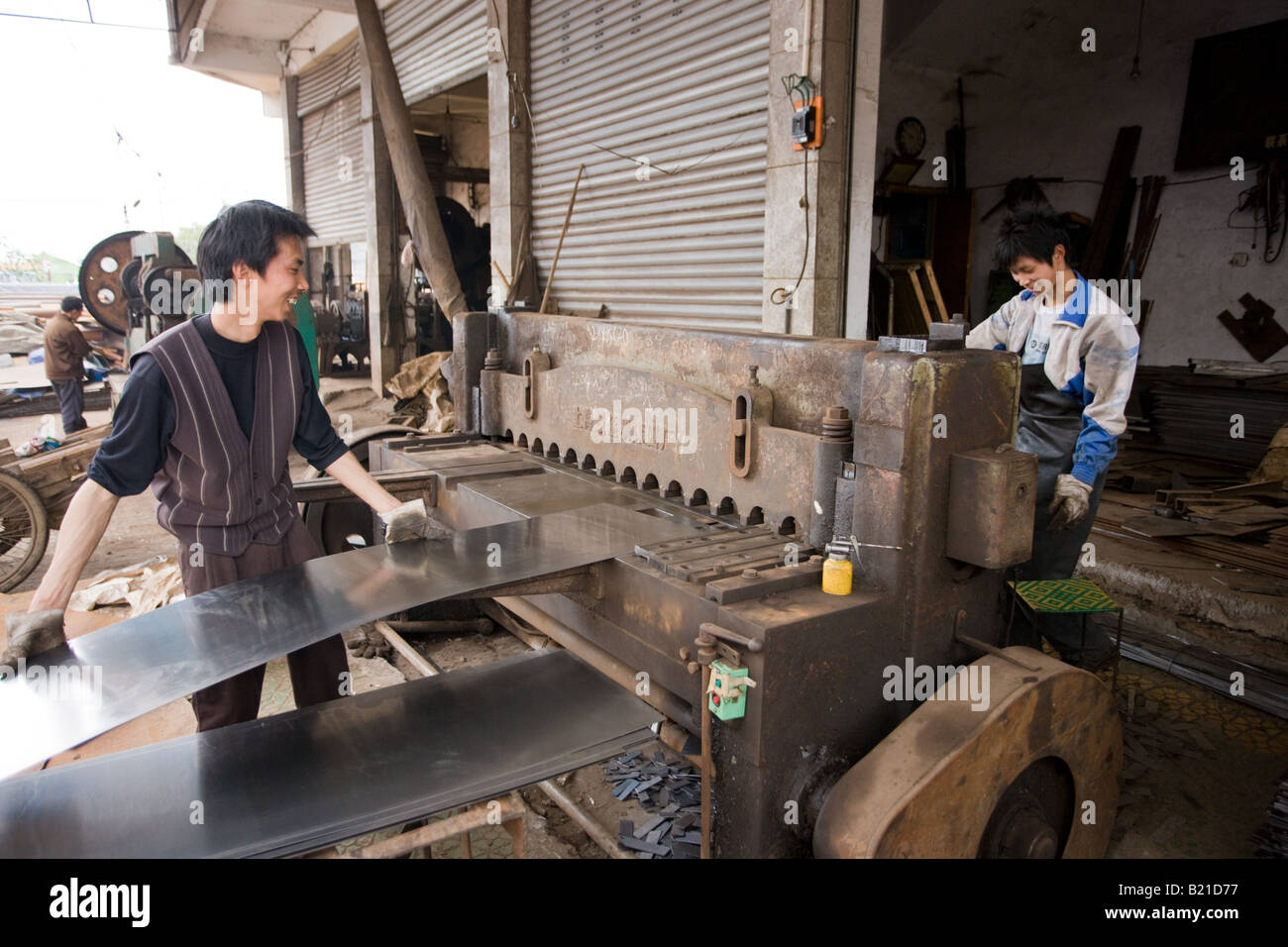 Men working at metal recycling steel in Dazu County Chongqing China Stock Photo