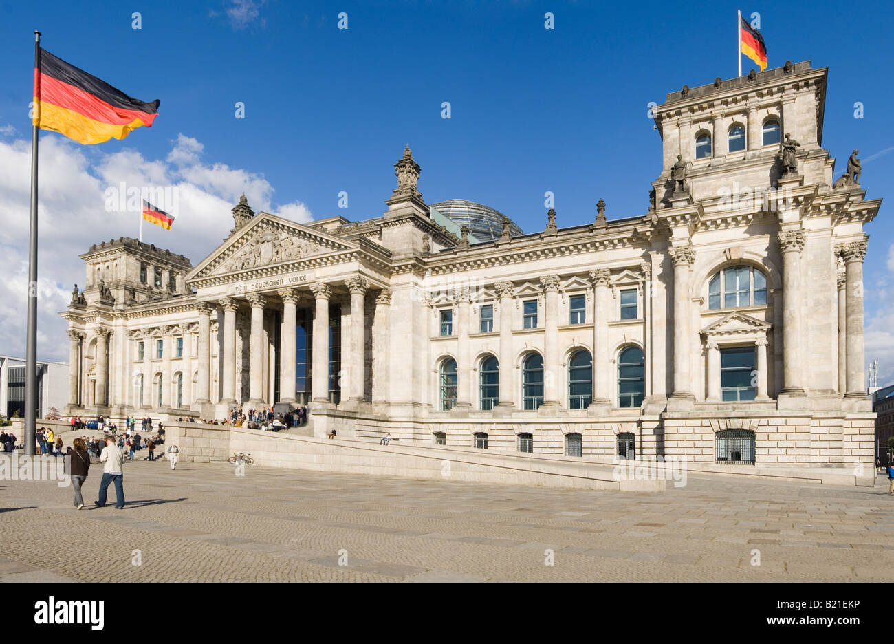 A 3 picture stitch panoramic view of the Reichstag (German Parliment Building) and tourists on a sunny day. Stock Photo