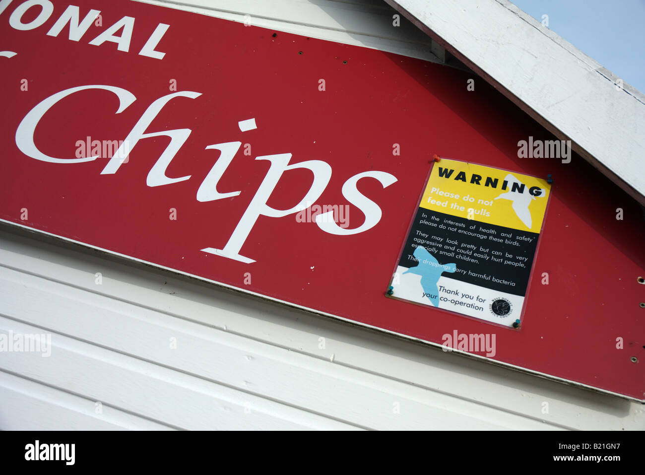 Traditional chip shop sign and dont feed seagulls Stock Photo Alamy