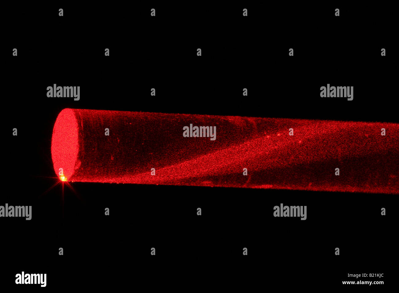 laserlight in glassfibre. Variable refractive index reduces loss of light. Stock Photo