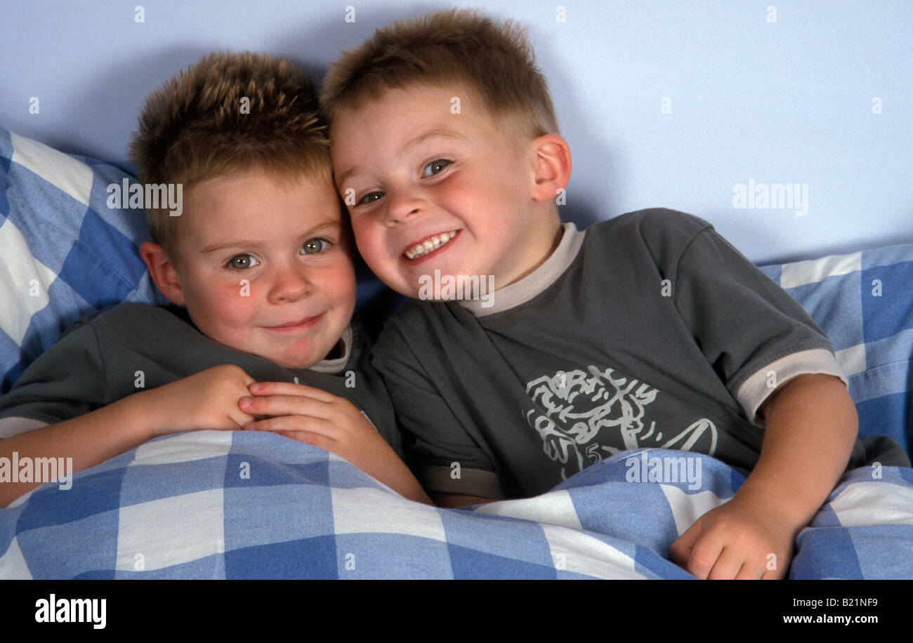 cheeky-little-twin-boys-laying-in-bed-B2