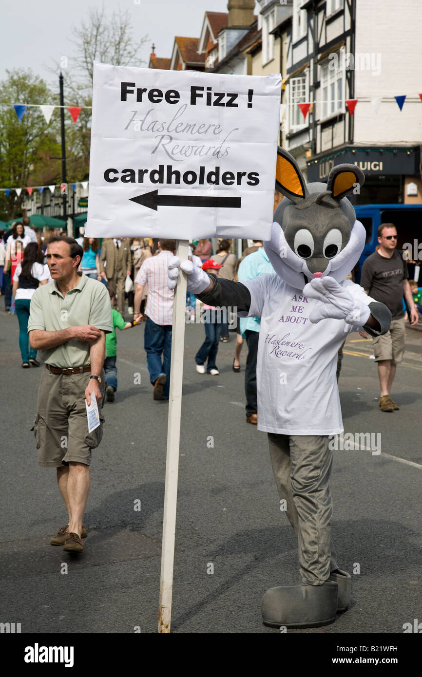 A rabbit tries to tempt passers by to a free drink during the biennial ...