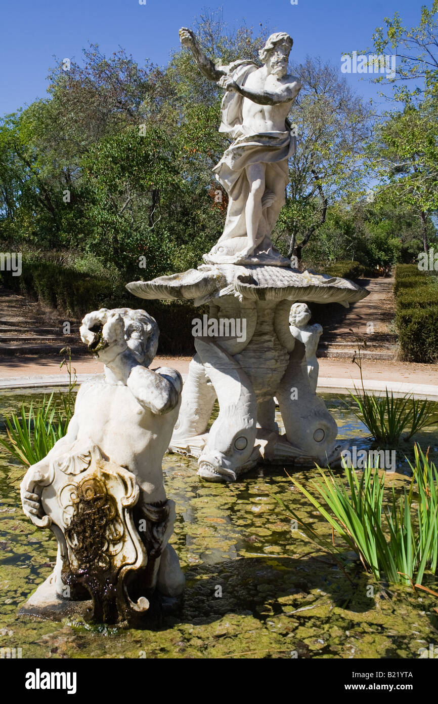 One of the various fountains in the Queluz palace gardens. Decorated with sculptures of King Neptune and Tritons. Stock Photo
