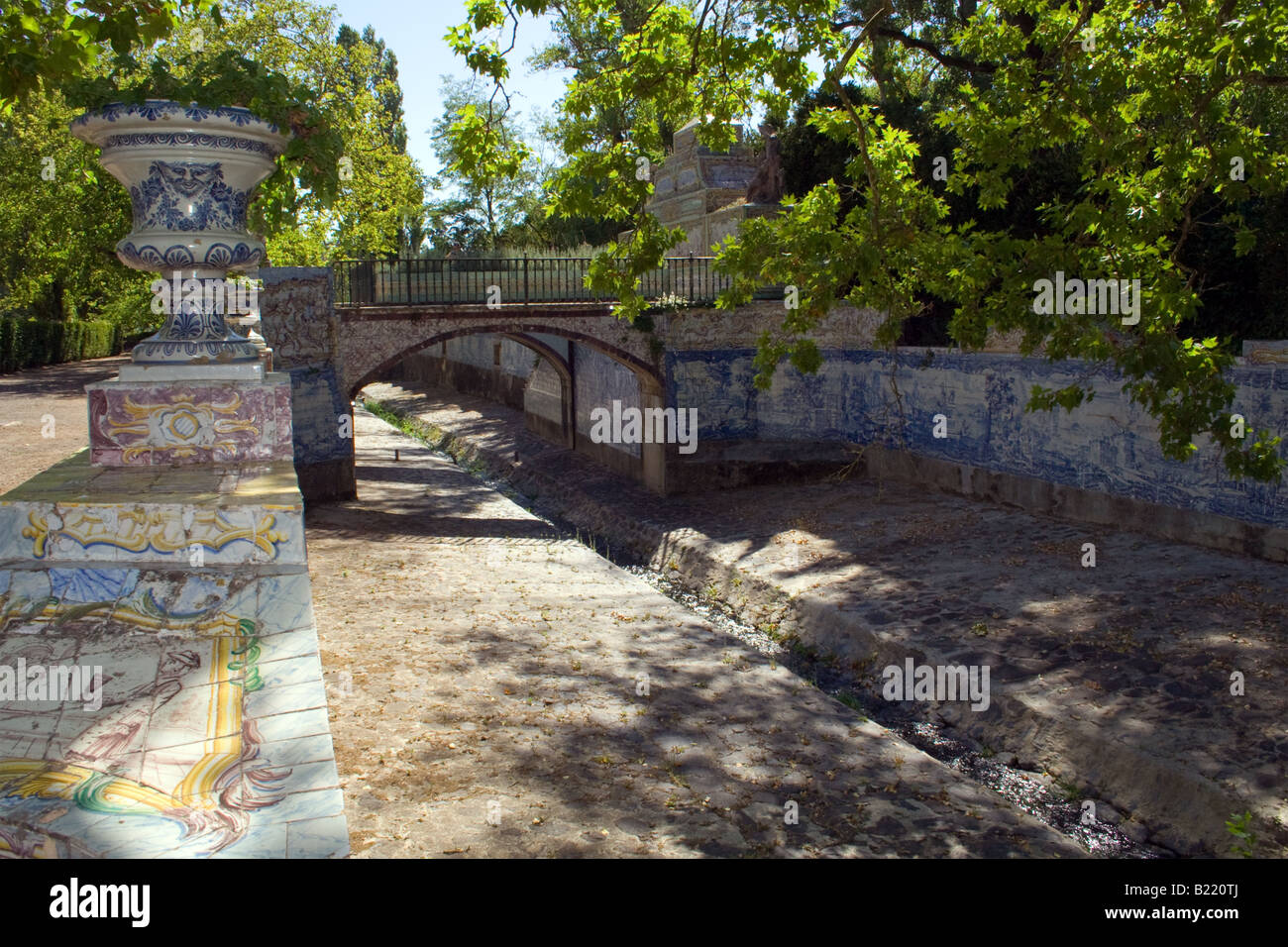 Queluz palace gardens. In this image it’s shown the Jamor river canal which is decorated with traditional Portuguese tiles. Stock Photo