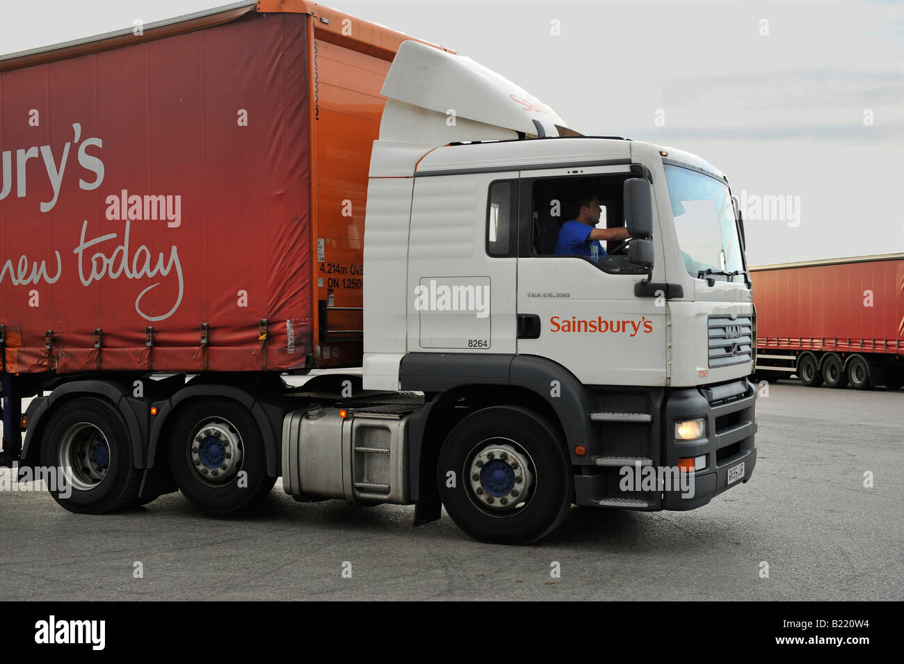 Sainsbury s truck MAN TGA tractor unit and curtainsided trailer Stock Photo