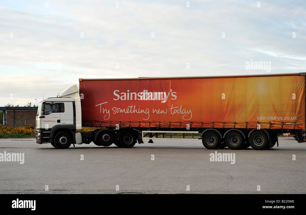 Sainsbury s truck MAN TGA tractor unit and curtainsided trailer Stock Photo