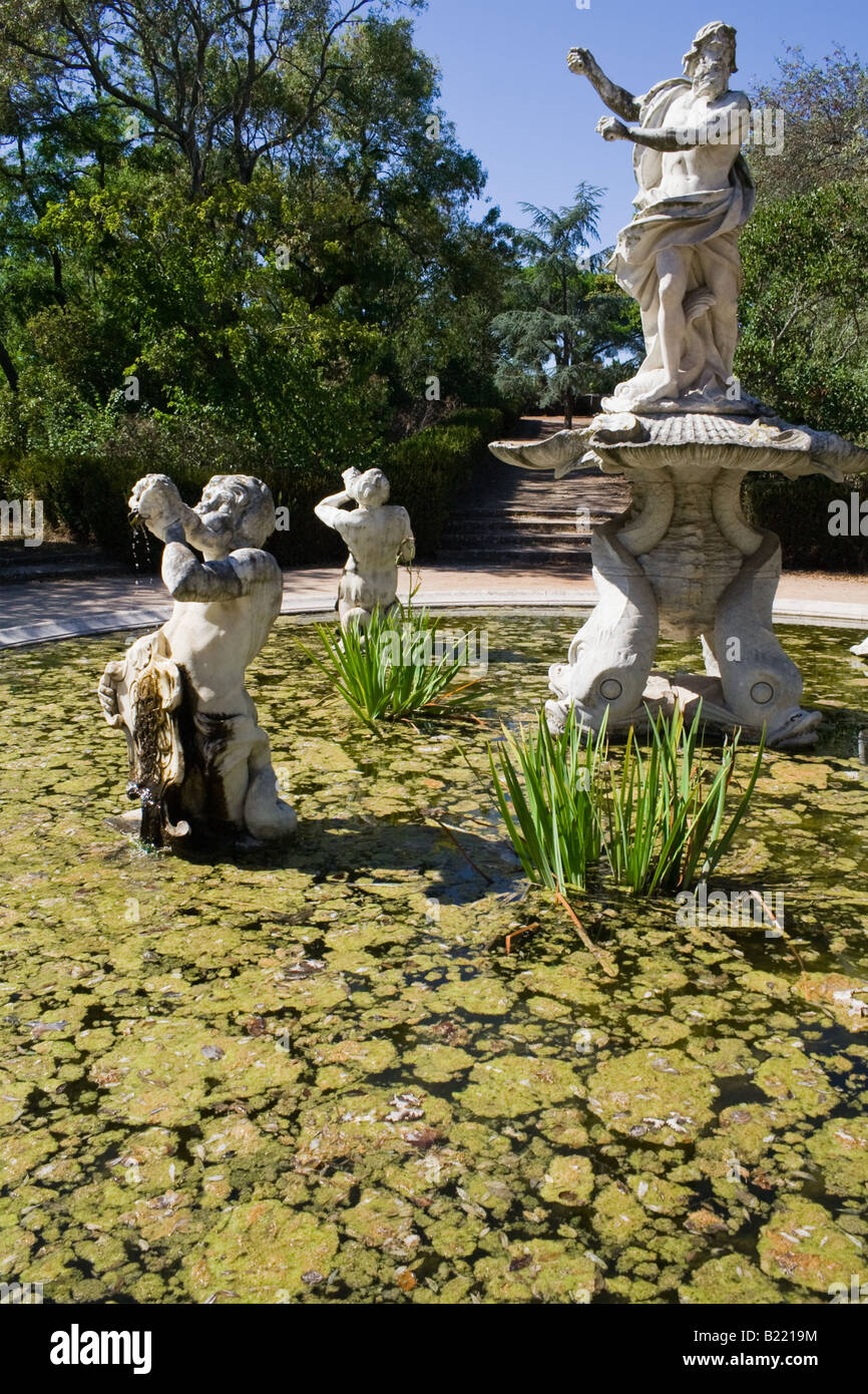 One of the various fountains in the Queluz palace gardens. Decorated with sculptures of King Neptune and Tritons. Stock Photo