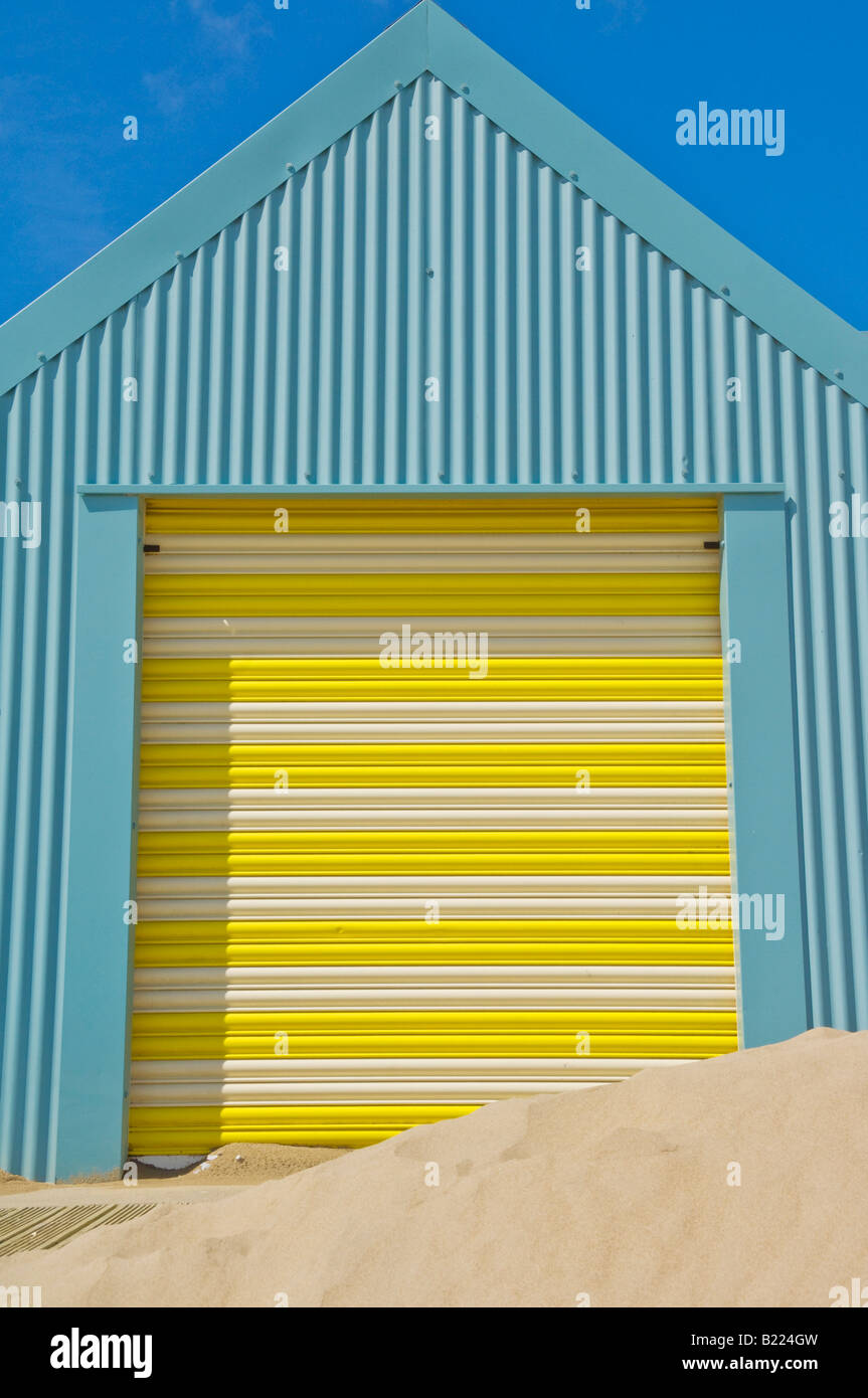 Beach hut with yellow and white doors Abersoch beach on the Llyn Lleyn peninsula Gwynedd North Wales UK GB EU Europe Stock Photo