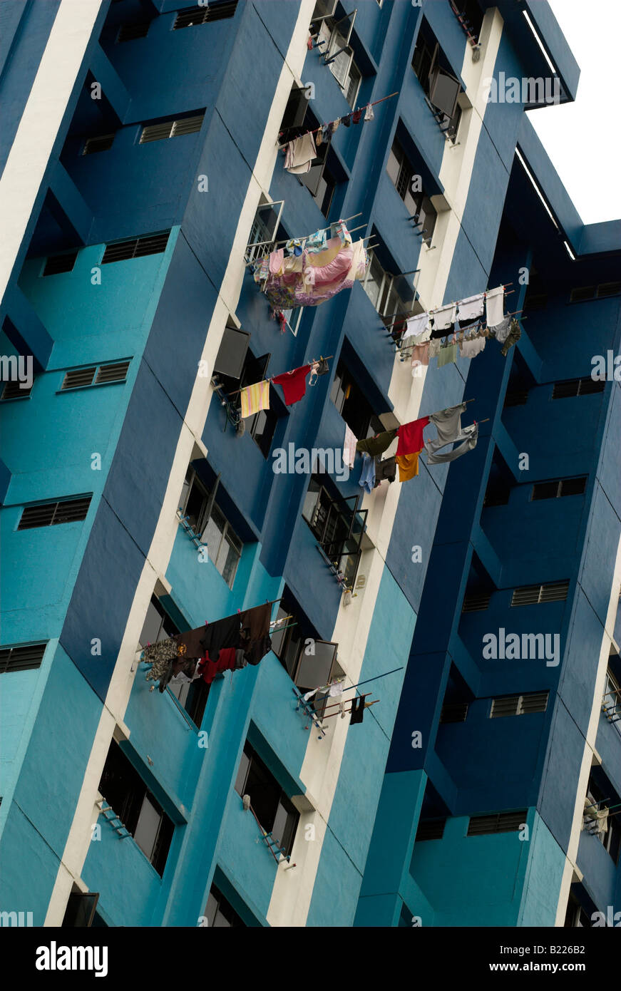 Laundry drying at a high rise apartment block, Singapore Stock Photo