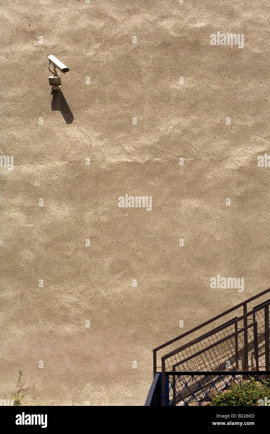 Surveillance camera on a wall Stock Photo - Alamy