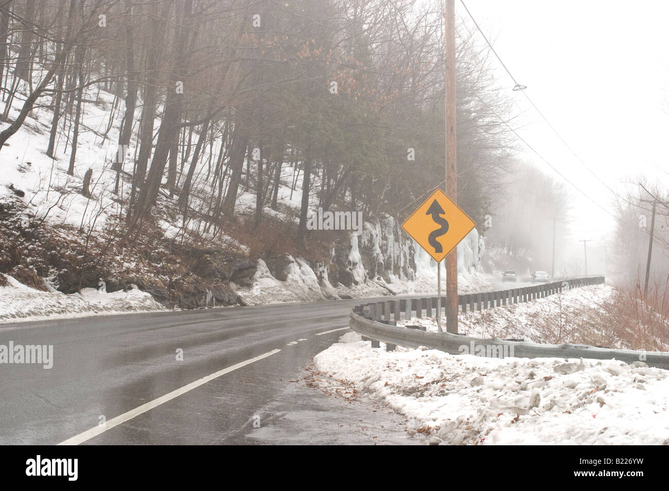 Ice and fog makes the hairpin turn on Massachusetts Mohawk Trail dangerous driving Stock Photo