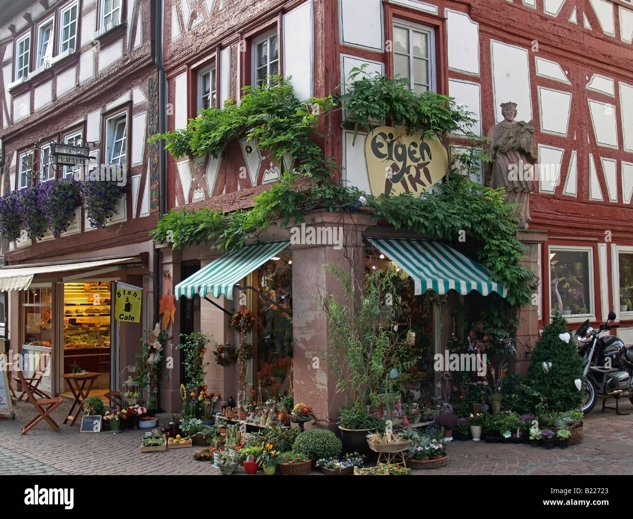 flower shop in narrow lane street with old half timbered houses in old
