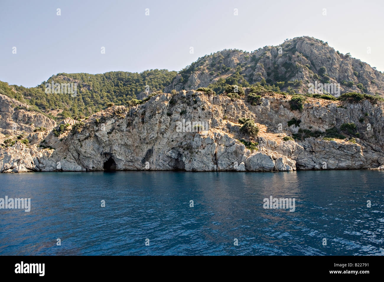Seaside rocks near resort of Icmeler Marmaris Mugla Turkey Stock Photo