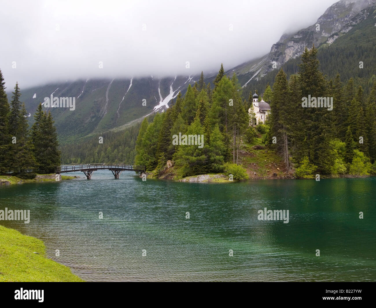 The small church of Maria am See on an island in the Obernberger See Austria at altitude of 1600 metres near the Italian border Stock Photo